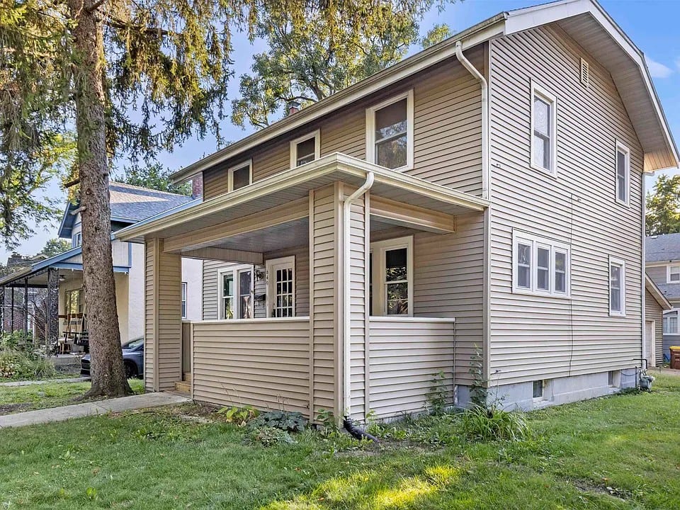 A renovated two-storey home with a covered porch